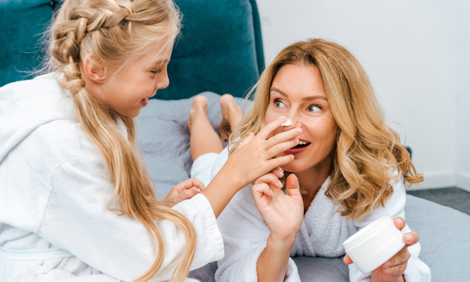 mom and daughter doing skincare